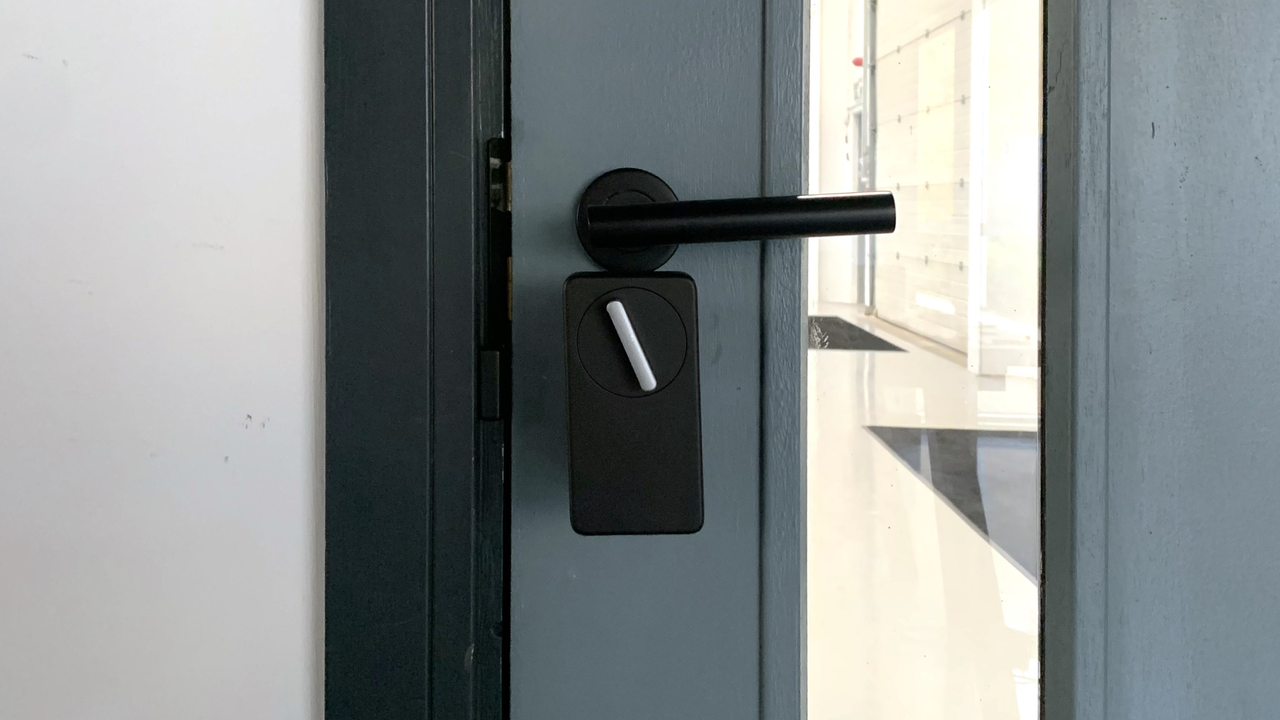SwitchBot Lock fitted on a door