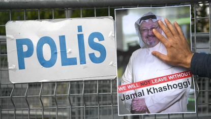 Protesters hold an image of Jamal Khashoggi outside the Saudi consulate in Istanbul