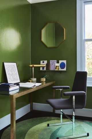 Home office area with green gloss walls, desk and chair