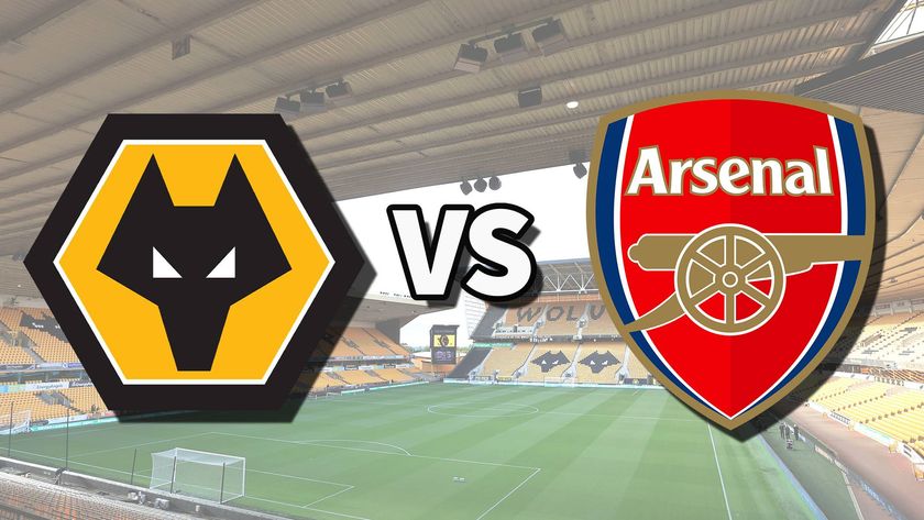 The Wolverhampton Wanderers and Arsenal club badges on top of a photo of Molineux stadium in Wolverhampton, England