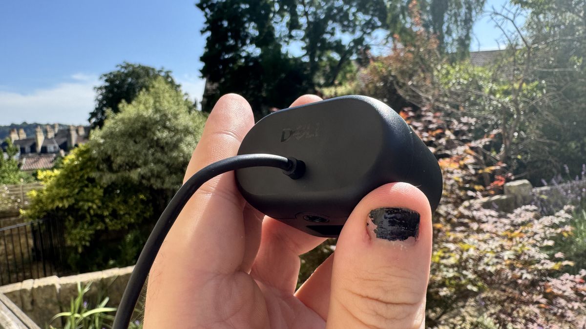 Dell Pro 5 webcam from behind, showing tethered wire, outside