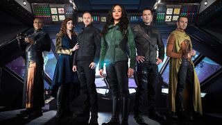 "Killjoys" cast members pose at the helm of a futuristic ship
