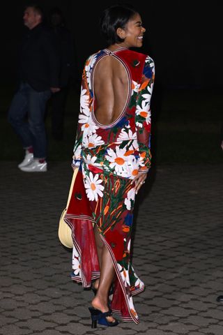 Gabrielle Union Burberry show backless floral dress thong straps heels sandals yellow saddle handbag London Fashion Week