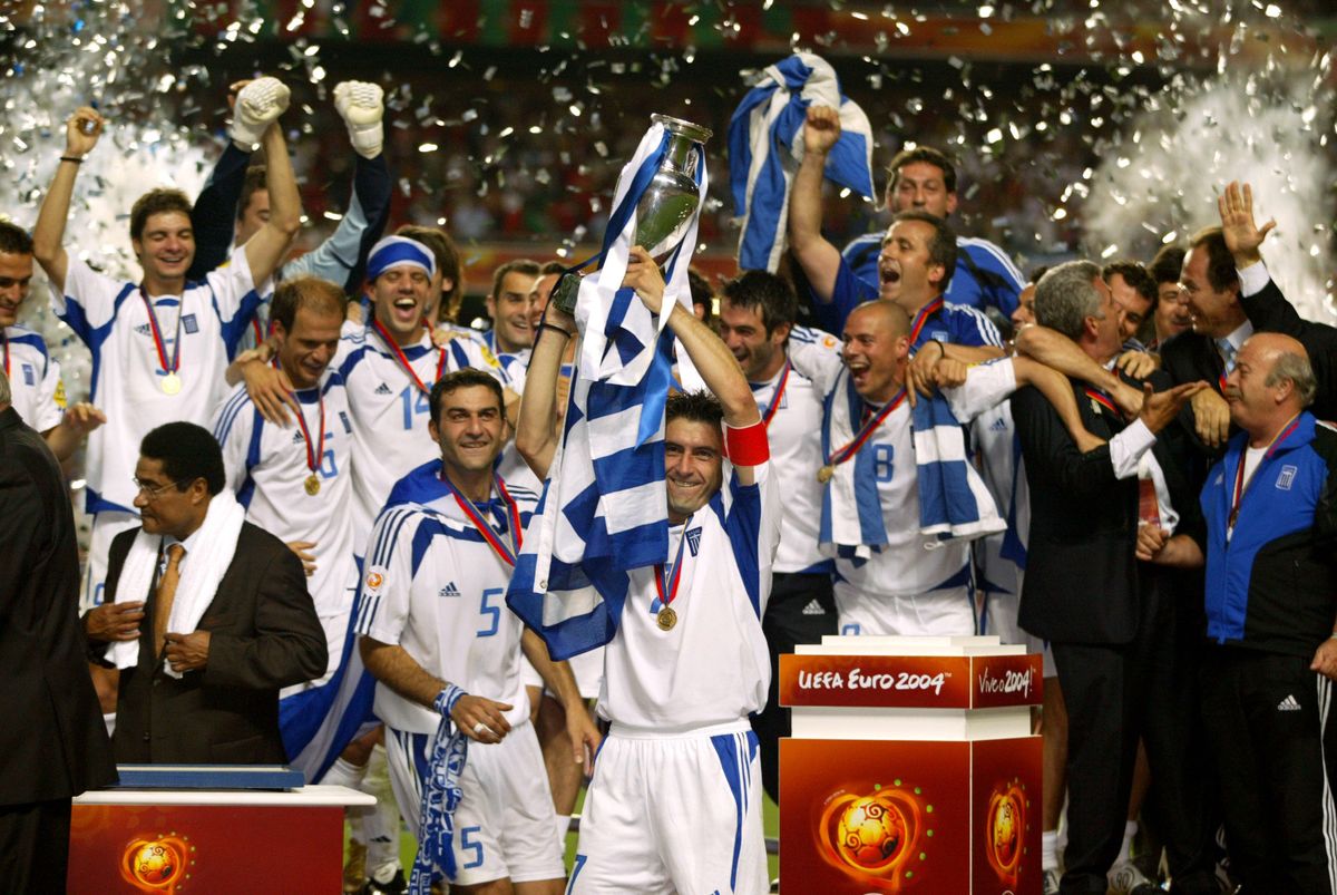 Greece captain Theodoros Zagorakis lifts the trophy after victory in the Euro 2004 final against Portugal in Lisbon