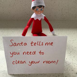 scout elf with a note from Santa