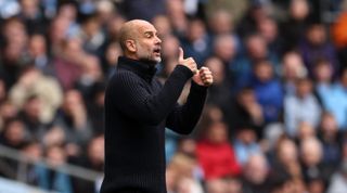 Manchester City manager Pep Guardiola gives his team instructions during the Premier League match between Manchester City and Liverpool at the Etihad Stadium on April 1, 2023 in Manchester, United Kingdom.
