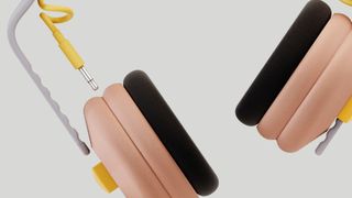 Kibu headphones deconstructed to show the modular build, on beige background