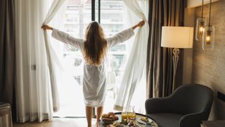 Hotel and travel concept. Background with unrecognizable person. Breakfast served on table. Leisure, relaxation and wellbeing. Morning in hotel.