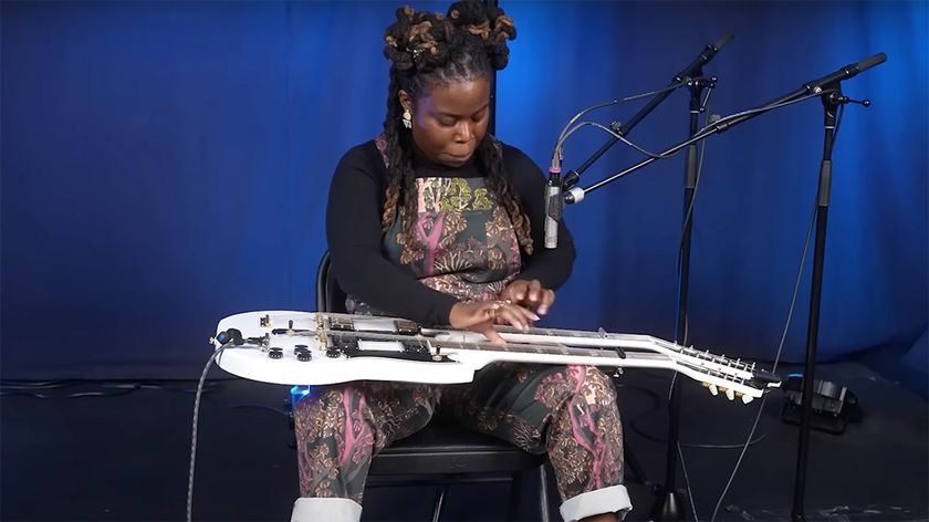 Yasmin Williams lap-tapping on a Gibson double-neck