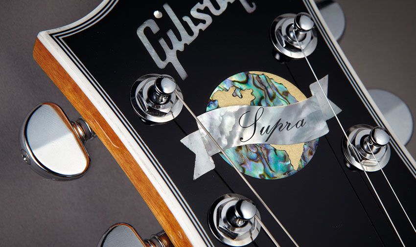The Supra's abalone headstock inlay underlines a high-end vibe within the Custom-style bound headstock