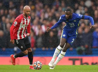 Southampton’s Nathan Redmond (left) and Chelsea’s Antonio Rudiger battle for the ball during the Premier League match at Stamford Bridge, London. Picture date: Saturday October 2, 2021