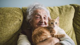 old lady with orange cat