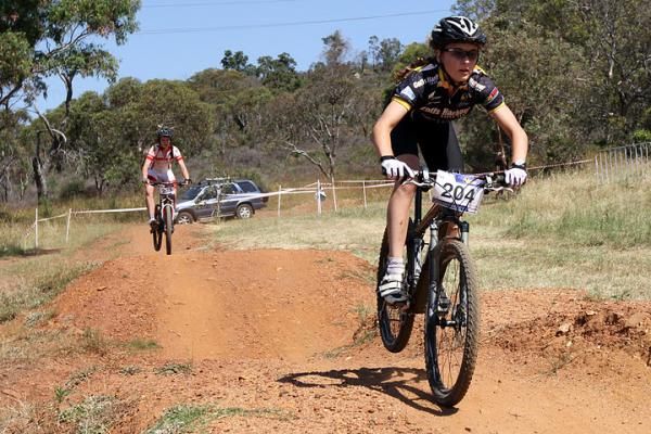 Emily Parkes leads Holly Harris in the U19 women's race. Parkes won the eliminator but Harris took the overall weekend title.