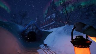 The player looks up at a foreboding manor house in a snowy landscape while holding a lantern.