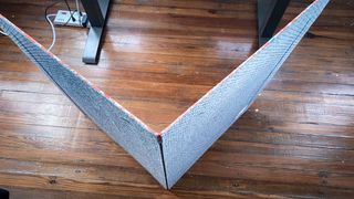 A PVC office chair mat folded in half