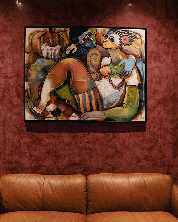 interiors at Mbari Kola, with design led furniture and art seen on walls