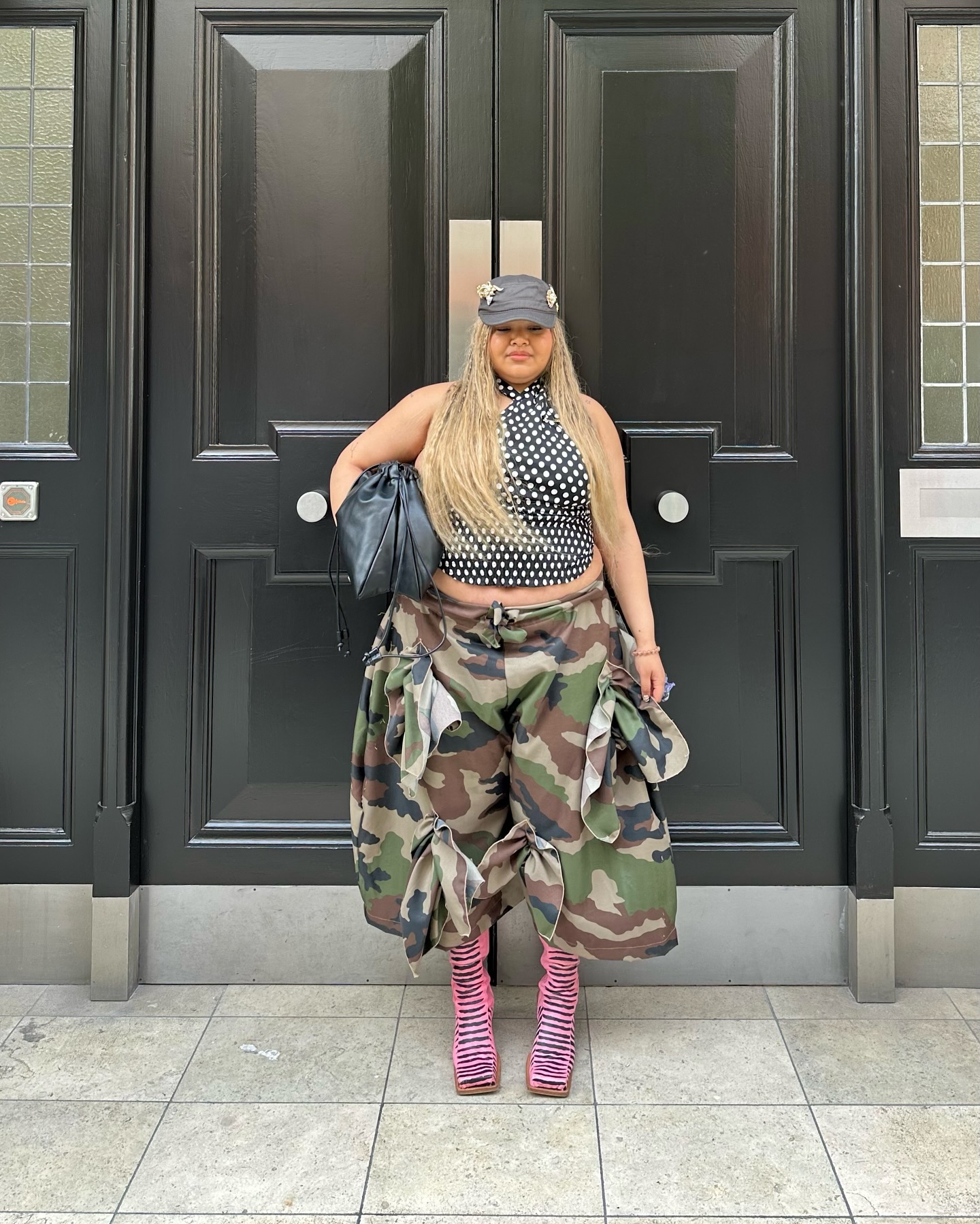 Girl on street wearing pink leopard print boots