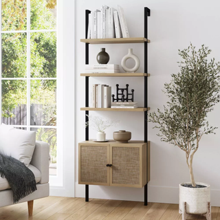 ladder bookshelf with a cabinet at the bottom