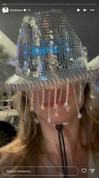 Brie Larson in a mirror ball cowboy hat with fringe.