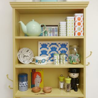 Kitchen shelves with a teapot and food storage
