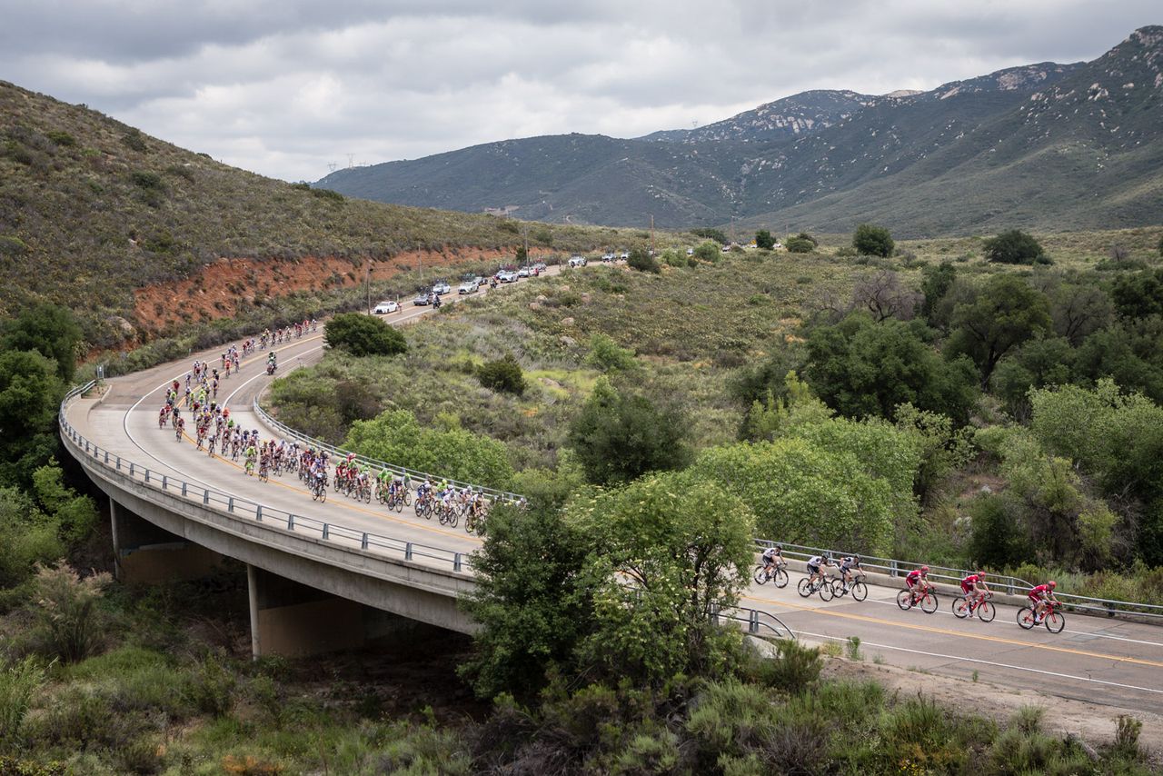 The peloton descends after passing the KOM