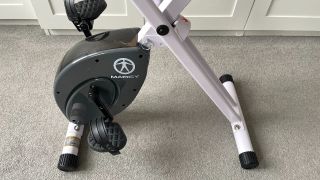 Detail of Marcy Foldable Exercise Bike flywheel and feet