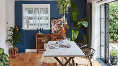 Blue dining room with marble table