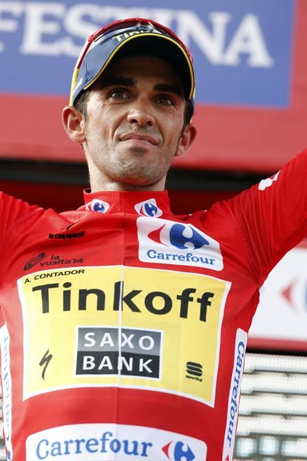 Race leader Alberto Contador (Tinkoff-Saxo) on the stage 18 podium in the red leader's jersey