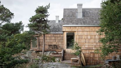 hero exterior of Saltviga House in the woods, on the south coast of Norway by Architects Kolman Boye Architects 