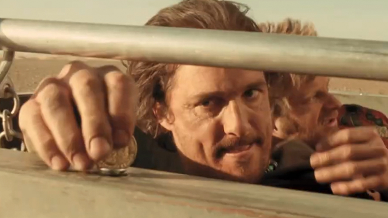 Matthew McConaughey using a coin to unscrew something in Sahara