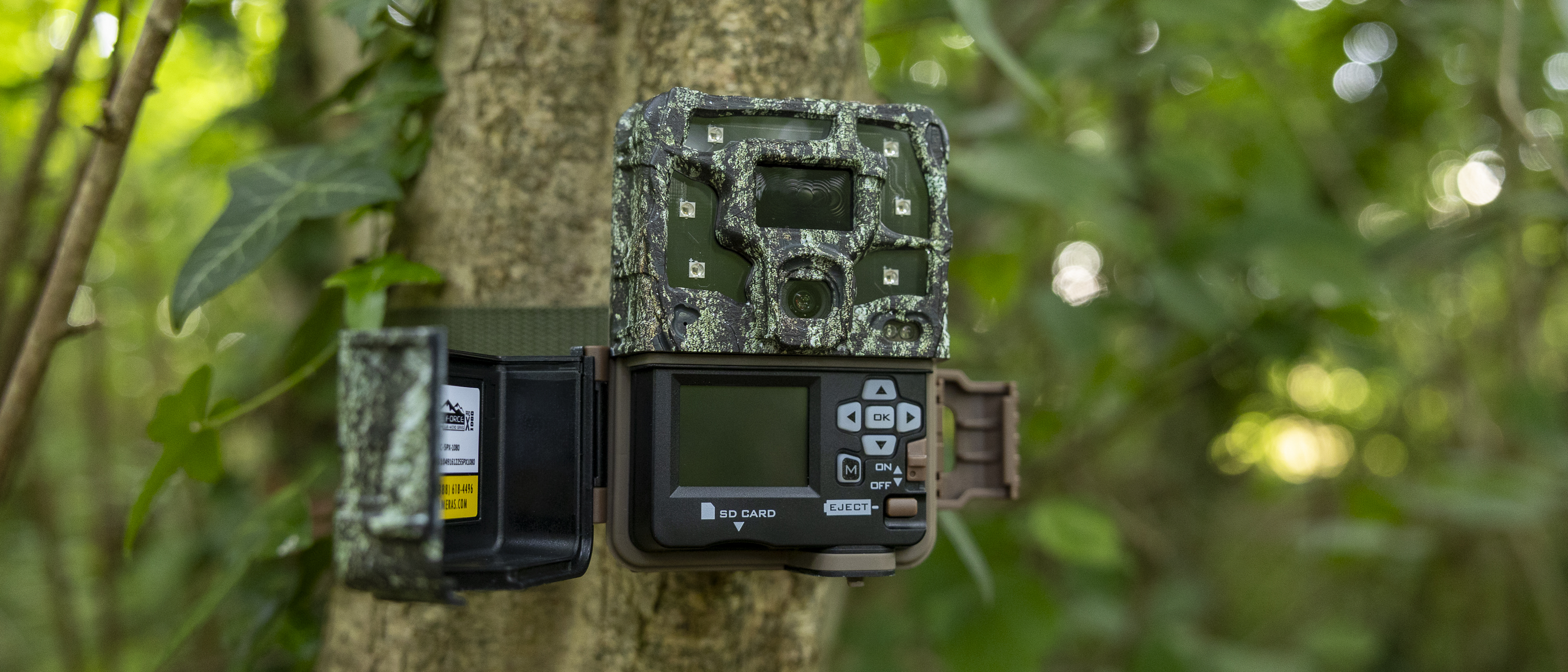 The Browning Strike Force Pro X 1080 attached to a tree in a woodland