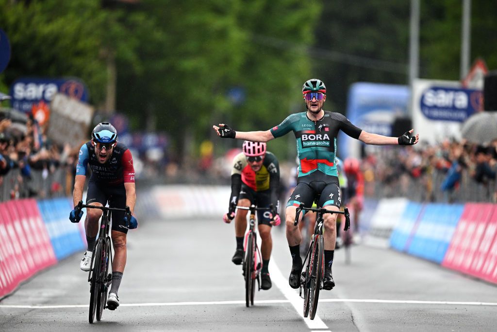 CASSANO MAGNAGO ITALY MAY 20 Nico Denz of Germany and Team BORA hansgrohe celebrates at finish line as stage winner ahead of Derek Gee of Canada and Team Israel Premier Tech during the 106th Giro dItalia 2023 Stage 14 a 194km stage from Sierre to Cassano Magnago UCIWT on May 20 2023 in Cassano Magnago Italy Photo by Stuart FranklinGetty Images