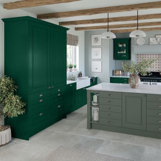 sage green kitchen island with emerald tall cabinets