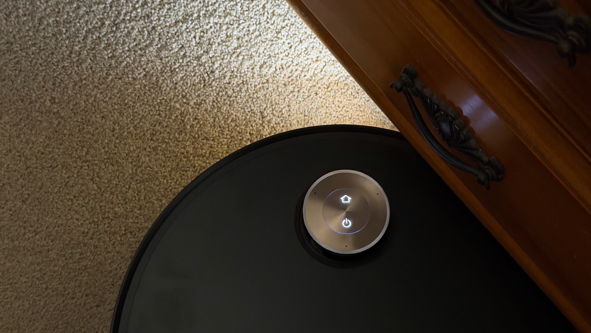 The headline of Dreame Aqua10 Ultra robot shining under furniture