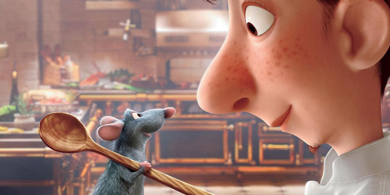 A rat holds a large wooden spoon and looks at a chef