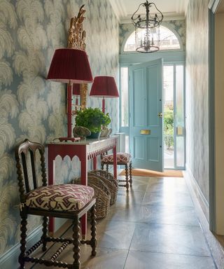 hallway with pretty furniture and blue door