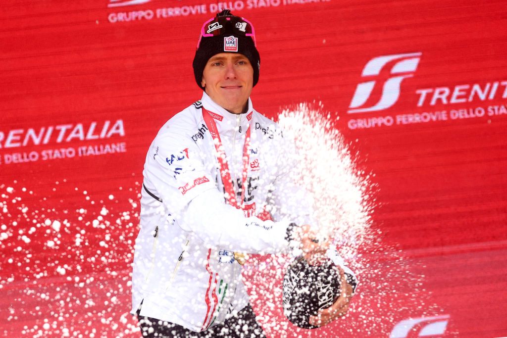Team UAE's Slovenian rider Tadej Pogacar celebrates on the podium after winning the 16th stage of the 107th Giro d'Italia cycling race, 206km between Livigno and Santa Cristina Val Gardena on May 21, 2024. Team UAE's Slovenian rider Tadej Pogacar wins his 5th stage in the 107th Giro d'Italia cycling race. (Photo by Luca Bettini / AFP)