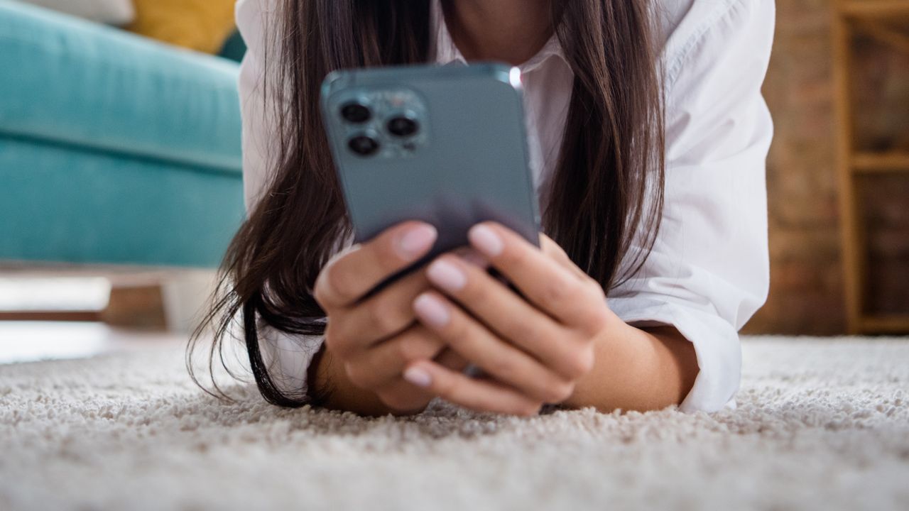 Woman holding iPhone