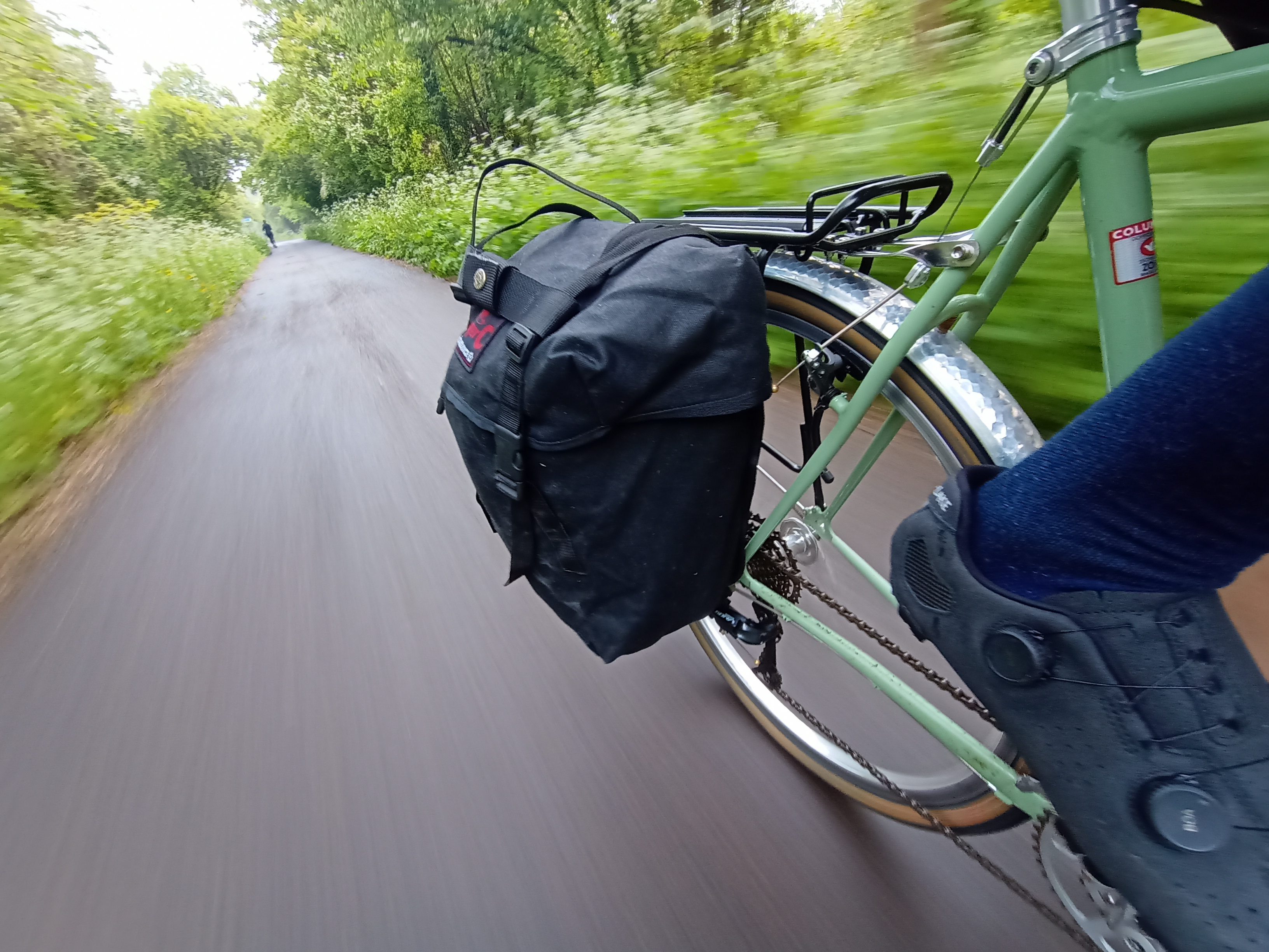 A pannier on a green bike