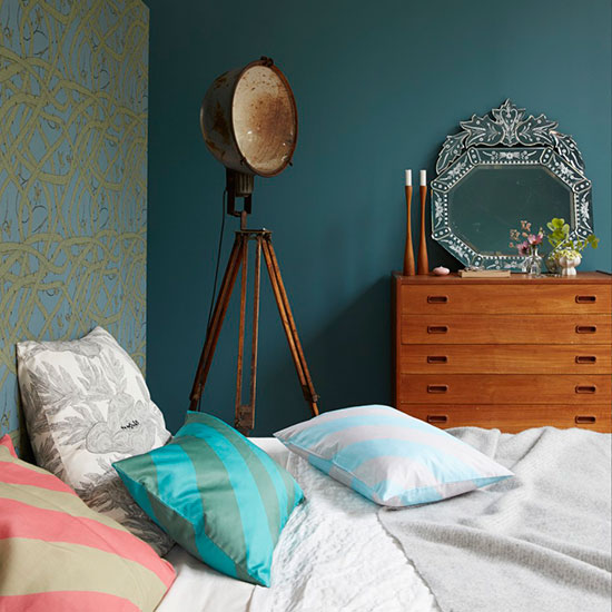 main bedroom with blue wall and wooden wardrobe