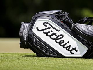 Titleist bag laying on the ground