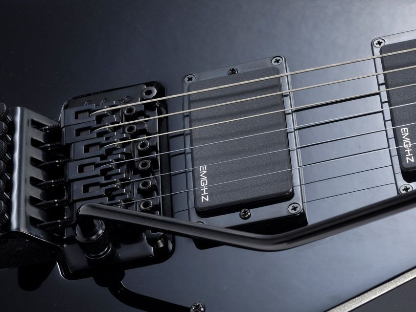 The PDX has a licensed vibrato and passive pickups for a low price.