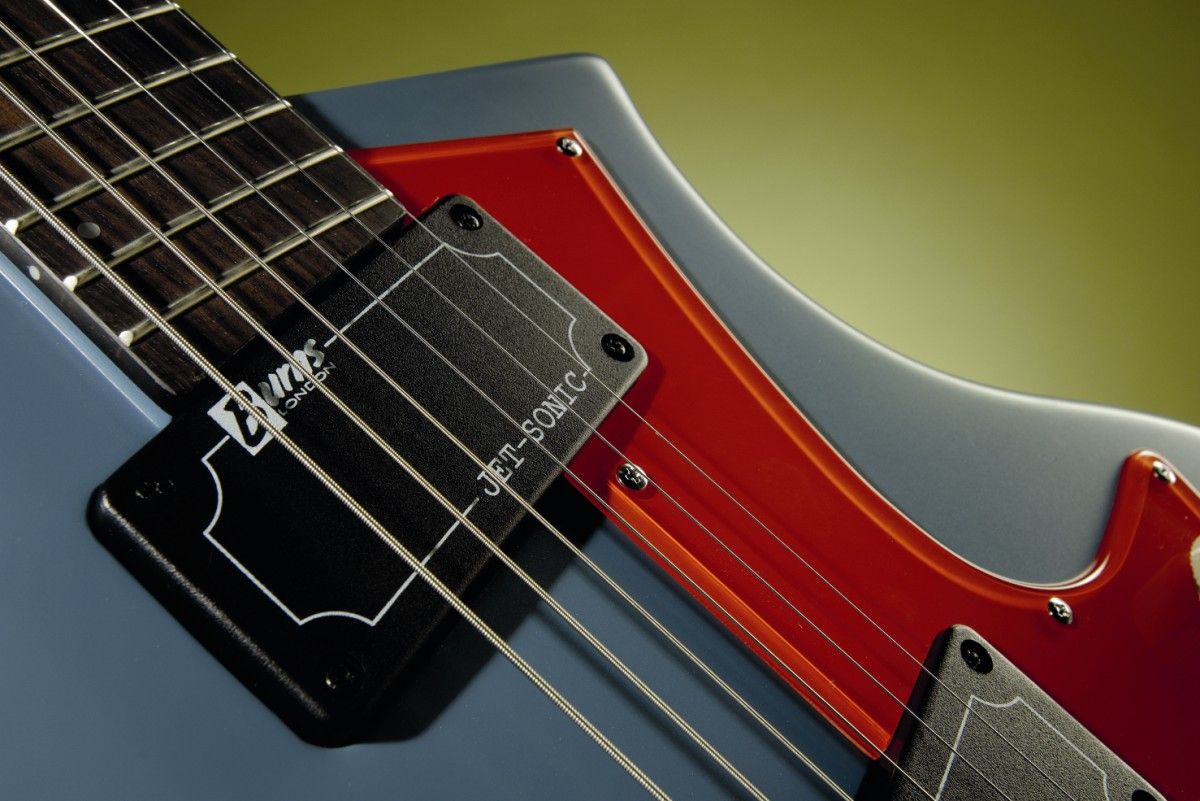 The blue finish option sports a bright scarlet pickguard