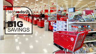 The inside of a Target store showing the cashiers and a trolley next to shelves of toys