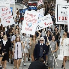 People, Protest, Dress, Street fashion, Public event, Poster, Rebellion, Handwriting, Banner, Handbag, 