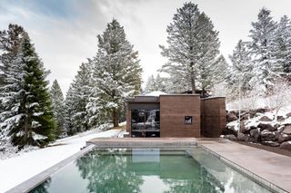 The pool and Yoga studio at at Wyoming holiday camp in the snow