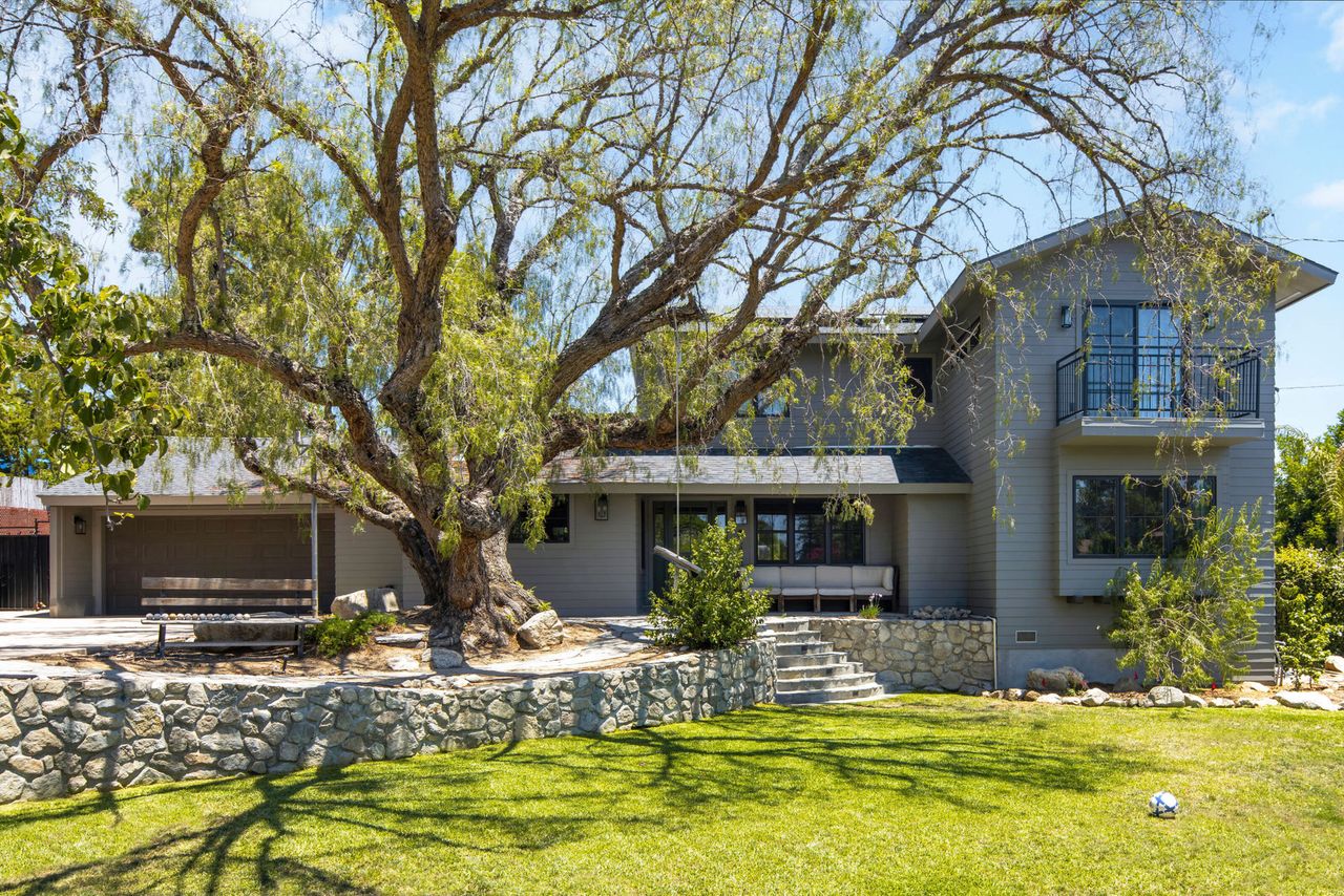 View of house exterior with raised front yard