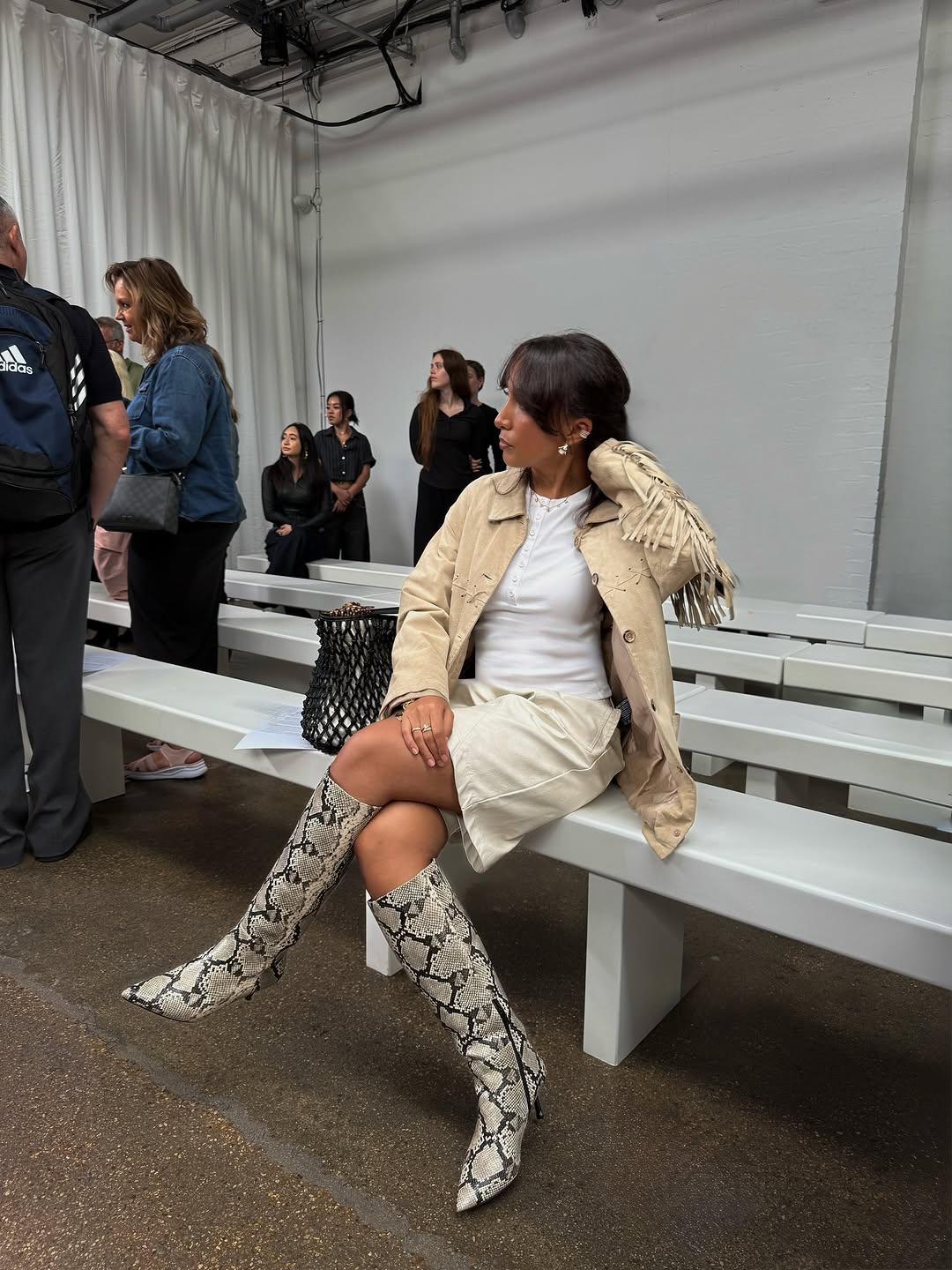 woman wearing bermuda shorts with boots outfit 2025