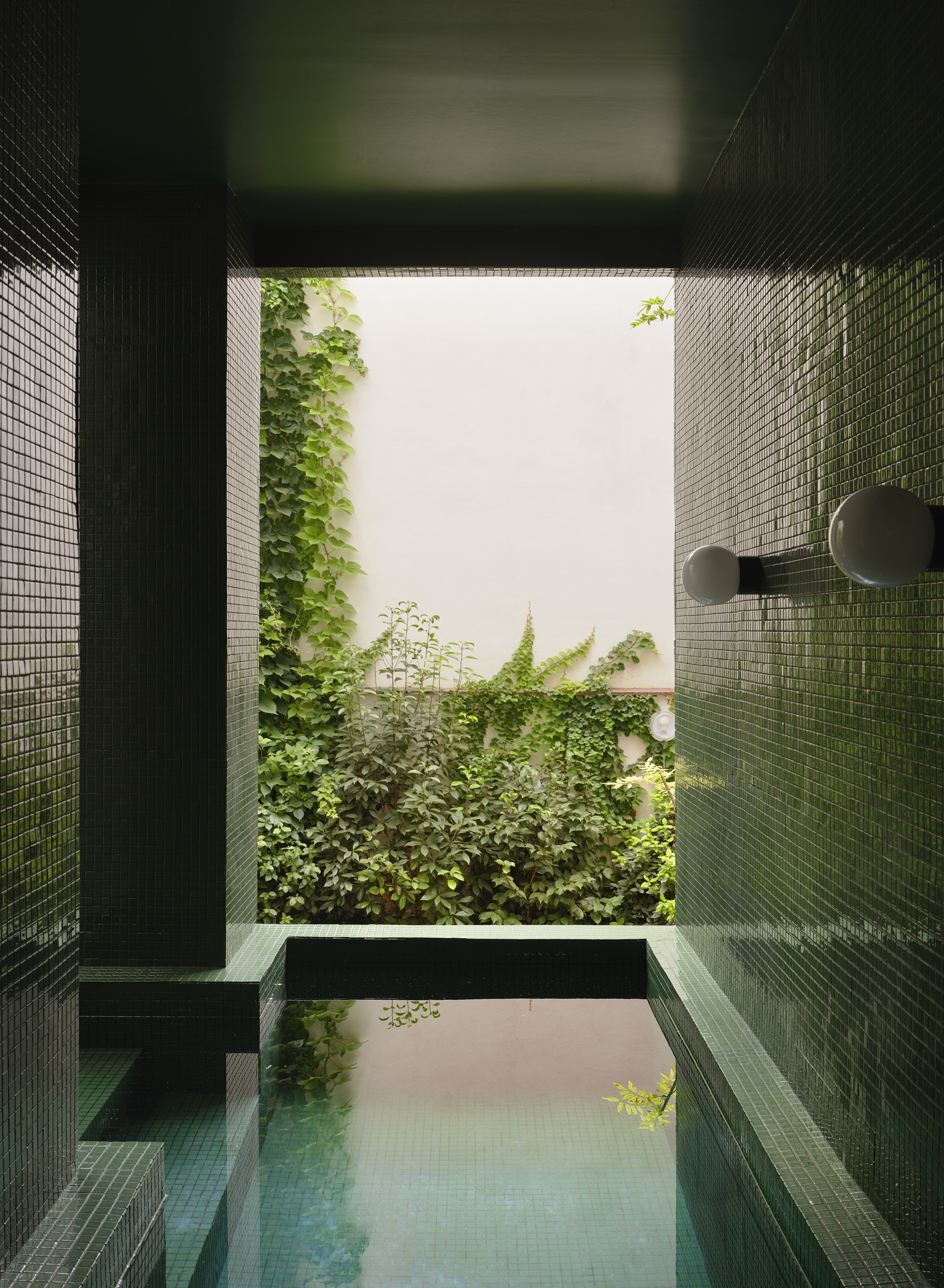 outdoor pool with moss green tiles