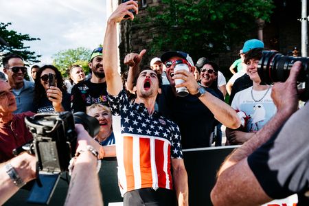 Elite men's winner Lucas Bourgoyne celebrates with the crowd in Somerville